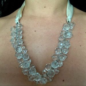 Gorgeous crystal statement necklace with crystal beads and cream ribbon tie.